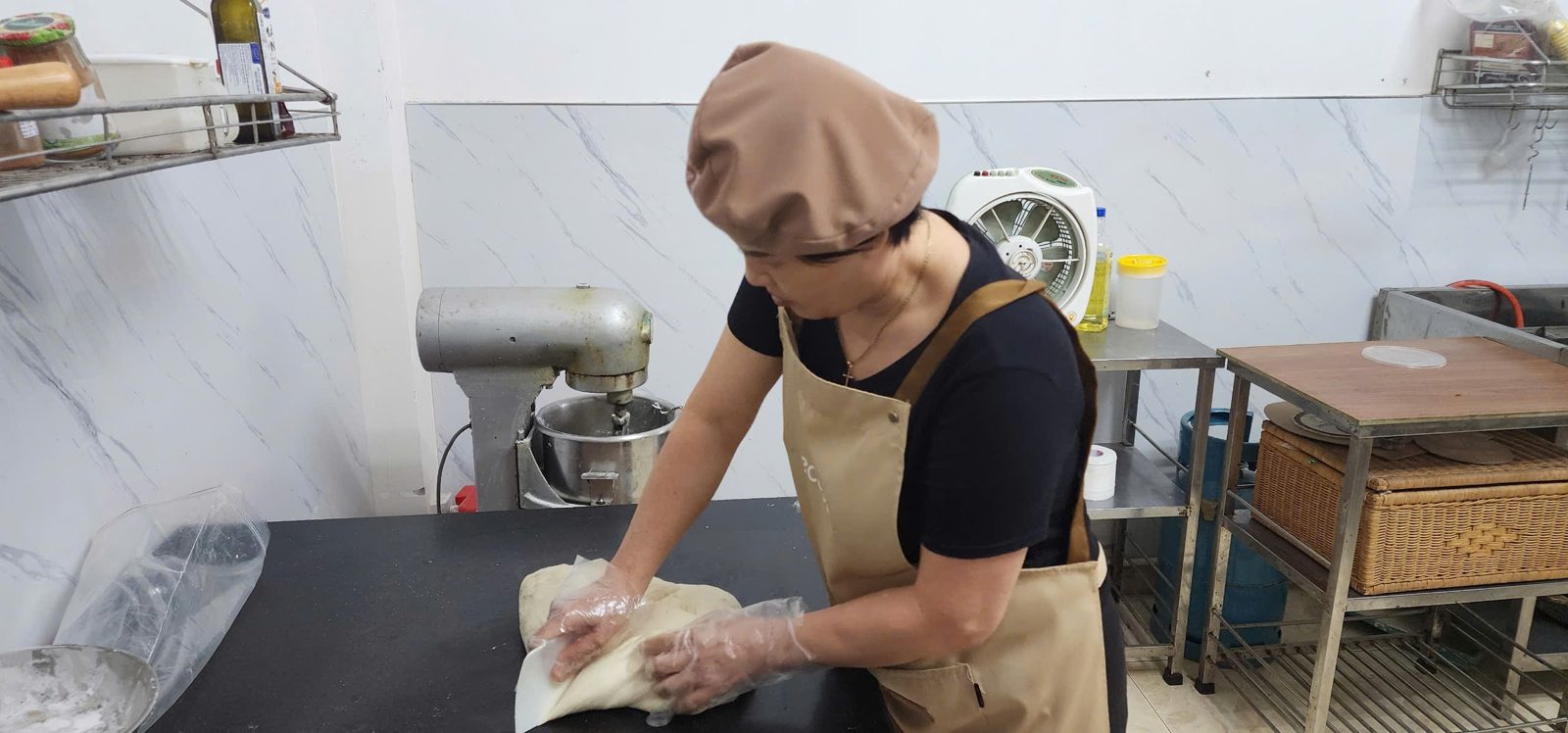 Our baker kneading dough